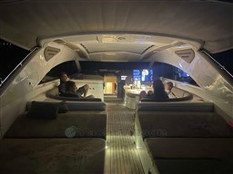 Luxurious 2002 Princess V65 yacht interior with ambient lighting and comfortable seating.