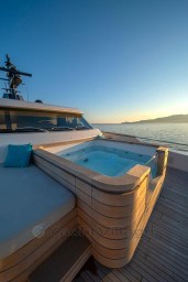 Luxurious Sanlorenzo SD96 yacht with jacuzzi at sunset, 2022 model.