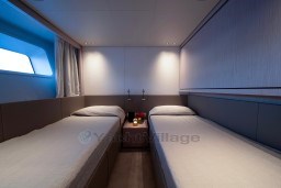 Luxurious twin cabin interior of 2022 Sanlorenzo SD96 yacht, featuring modern design and ambient lighting.