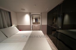 Luxurious bedroom interior of 2022 Sanlorenzo SD96 yacht, featuring modern design and elegant furnishings.