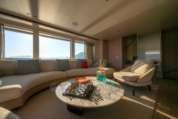 Luxurious Sanlorenzo SD96 yacht interior with elegant seating, chessboard, and scenic views, 2022 model.