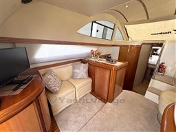 Luxurious interior of 2002 Rodman 38fly yacht with cozy seating and modern amenities.