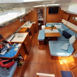 Interior of 2008 Beneteau Oceanis 43 yacht with cozy seating and wooden finishes.