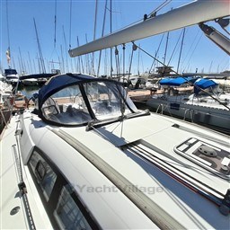 2008 Beneteau Oceanis 43 sailboat docked in a marina under clear blue skies.
