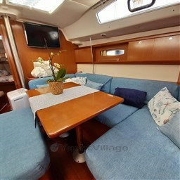 Interior of 2008 Beneteau Oceanis 43 yacht with cozy seating and table.