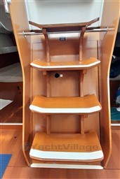 Wooden interior stairs of a 2008 Beneteau Oceanis 43 sailboat.