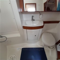 Bathroom interior of 2008 Beneteau Oceanis 43 yacht with sink and toilet.