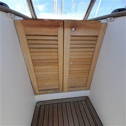 Wooden hatch doors on a 2008 Beneteau Oceanis 43 sailboat.