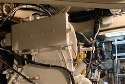 Engine room of 2006 Azimut Atlantis 55 yacht, showcasing mechanical components and wiring.