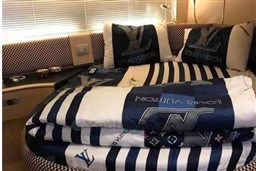 Luxurious Azimut Atlantis 55 yacht interior with Louis Vuitton bedding, 2006 model.