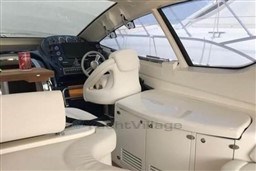 Interior of 2006 Azimut Atlantis 55 yacht with modern helm and white seating.