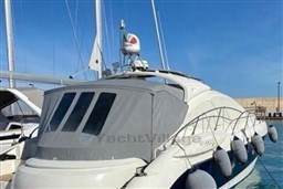 2006 Azimut Atlantis 55 yacht docked in marina, featuring sleek design and protective cover.