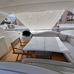 Luxurious interior of 2004 Primatist G 50 Speedster yacht with elegant seating and table.