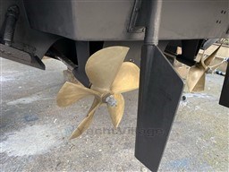 Propeller and rudder of 2004 Primatist G 50 Speedster boat on dry dock.