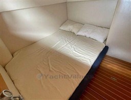 Interior cabin of 2004 Primatist G 50 Speedster with cozy bed and pillows.