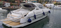2004 Primatist G 50 Speedster yacht docked in a marina, showcasing sleek design and luxury features.