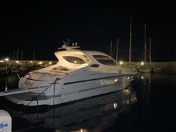 2004 Primatist G 50 Speedster yacht docked at night in a marina.