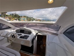 Interior view of 2004 Primatist G 50 Speedster yacht cockpit with control panel.