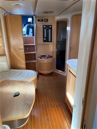 Luxurious interior of 2004 Primatist G 50 Speedster yacht with wood finish and seating area.