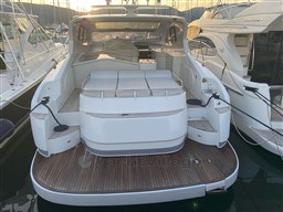 2004 Primatist G 50 Speedster yacht docked at marina, rear view.