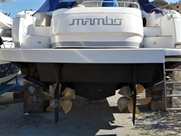 2004 Primatist G 50 Speedster yacht on dry dock, showcasing dual propellers.
