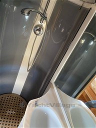 Shower area in 2004 Primatist G 50 Speedster yacht with modern fixtures.