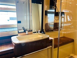 Luxurious bathroom interior of 2011 Azimut Magellano 50 yacht with modern fixtures.