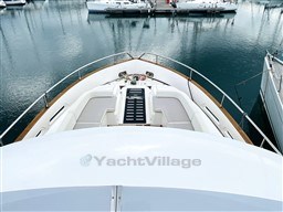 Bow view of 2011 Azimut Magellano 50 yacht docked in marina.