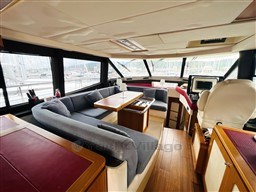 Luxurious interior of 2011 Azimut Magellano 50 yacht with spacious seating and elegant design.