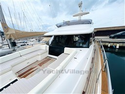 Azimut Magellano 50 yacht, 2011 model, docked with spacious deck and seating area.