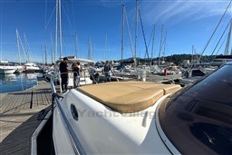 Mano Marine 24.50 boat docked at marina, 2007 model, with people onboard.