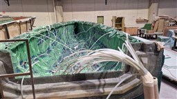 2024 Comuzzi Yachts C-32 Sport under construction in a workshop.