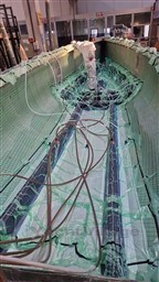 2024 Comuzzi Yachts C-32 Sport under construction, showcasing interior framework and wiring.