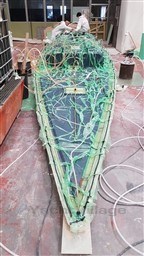 2024 Comuzzi Yachts C-32 Sport under construction, showcasing intricate wiring and craftsmanship.
