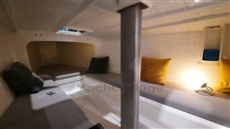 2024 Comuzzi Yachts C-32 Sport interior cabin with cozy seating and ambient lighting.