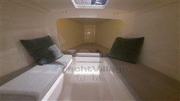 2024 Comuzzi Yachts C-32 Sport interior cabin with cushions and sleek design.