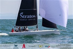 2024 Comuzzi Yachts C-32 Sport sailing in a regatta with crew onboard.