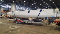 2024 Comuzzi Yachts C-32 Sport on trailer in indoor facility.