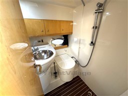 2006 Cranchi Smeraldo 37 yacht bathroom with sink, toilet, and shower.