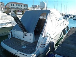 2006 Cranchi Smeraldo 37 yacht docked at marina with covered deck.