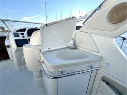 2006 Cranchi Smeraldo 37 yacht cockpit with sink and helm station.