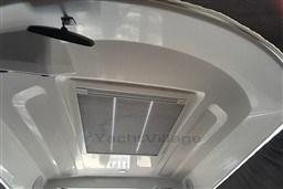 Interior view of 2022 Beneteau Antares 8 Fishing boat ceiling with hatch.