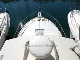 2009 Carolina Classic 28 boat docked between two others, viewed from above.