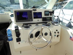 2009 Carolina Classic 28 boat dashboard with steering wheel and navigation equipment.