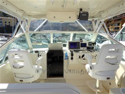 2009 Carolina Classic 28 boat interior with helm, dual seats, and navigation equipment.