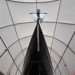 Bow view of 1989 Tecnomar Benetti 50 offshore yacht in a covered storage.