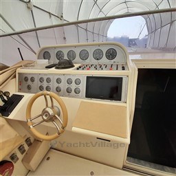 Control panel of 1989 Tecnomar Benetti 50 offshore yacht with steering wheel and gauges.