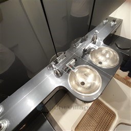 Luxury yacht bathroom with dual sinks, Tecnomar Benetti 50 Offshore, 1989 model.
