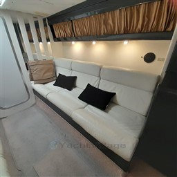Luxurious interior of 1989 Tecnomar Benetti 50 offshore yacht with white leather seating.