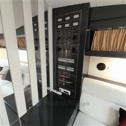 Control panel inside 1989 Tecnomar Benetti 50 offshore yacht, featuring switches and gauges.